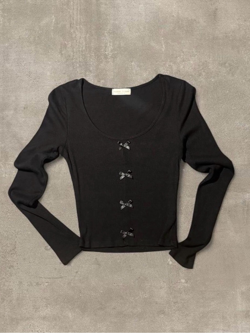 Black long sleeve button up shirt with bow details